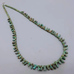 Laura Gr tab small1 — historical jewelry photograph